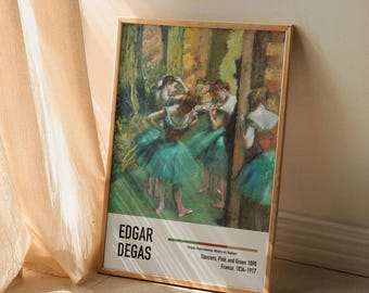 May include: A framed print of Edgar Degas' "Dancers, Pink and Green" from 1890. The artwork depicts ballerinas in green tutus and pink bodices, set against a backdrop of green and yellow tones. The print includes the artist's name and the artwork's details.