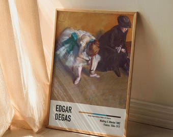May include: A framed poster of a painting by Edgar Degas titled "Waiting (L'Attente)" from 1862. The painting depicts two dancers, one in a white tutu and the other in a black dress, in a studio setting.
