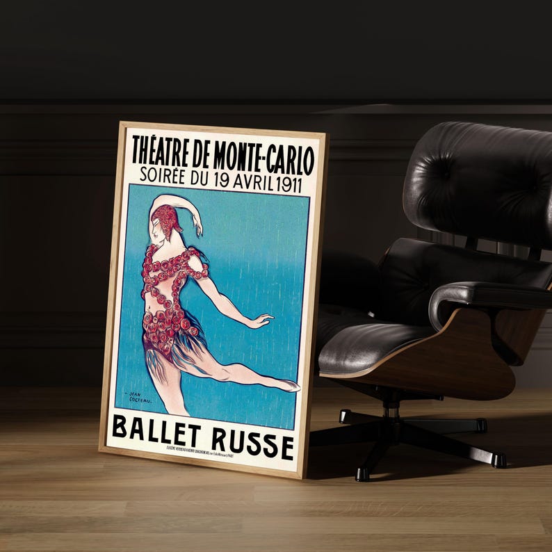May include: A vintage poster advertising the Ballet Russe performance at the Theatre de Monte-Carlo on April 19, 1911. The poster features a dancer in a flowing blue dress adorned with red roses, against a blue background with rain.