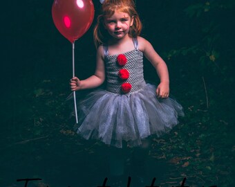 Pennywise IT inspired all in one tutu outfit with matching hair bow & blow up prop.