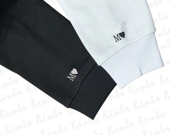 sweatshirt with initial on sleeve