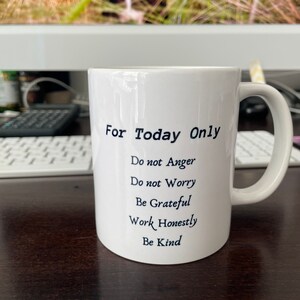 May include: White ceramic mug with black text that reads "For Today Only" and a list of positive affirmations: "Do not Anger", "Do not Worry", "Be Grateful", "Work Honestly", "Be Kind".