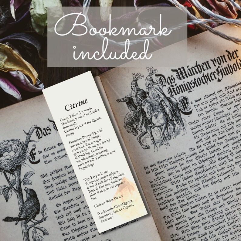 May include: A bookmark with a yellow and brown citrine crystal illustration. The bookmark features text describing the crystal's properties, including its color, hardness, and metaphysical benefits. The text also includes a tip on how to use the crystal for prosperity and a list of crystals that work well with citrine.