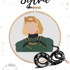 May include: Cross-stitch pattern of a woman with blonde hair wearing a green and gold shirt, with the word "Sylvie" above the pattern and the text "x-stitch by nic" below the pattern.