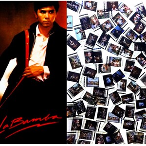 May include: Movie poster for "La Bamba" featuring a man in a black jacket holding a guitar. The title is in red script. The right side shows a collection of film stills from the movie.