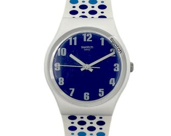 Swatch Gent PAVEBLUE GW201 - état neuf (jamais portée) - fonctionne avec une pile neuve - neuve dans sa boîte - diamètre 34 mm - bracelet en silicone souple