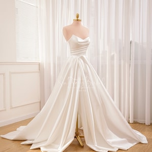 Sexy slit A-line wedding dress. White satin wedding dress with long train. Summer luxury wedding dress for the bride.