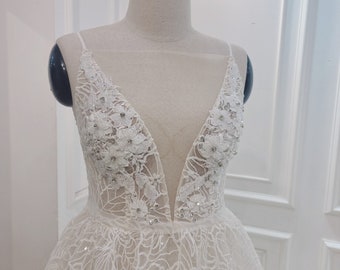 Sexy A-line wedding dress. Deep V-neck A-line wedding dress. Lace wedding gown. Backless A-line wedding dress