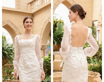 Custom wedding dress for bride. Short wedding dress with beautiful long sleeves. Short wedding dress with elegant floral decoration.