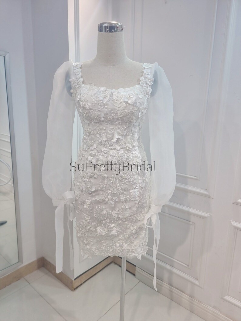 Custom wedding dress for bride. Short wedding dress with beautiful long sleeves. Short wedding dress with elegant floral decoration. image 9