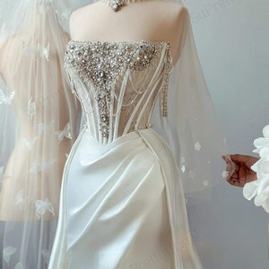 Sexy corset wedding dress with slit. Luxurious beaded wedding dress. Wedding dresses have convenient detachable skirts.