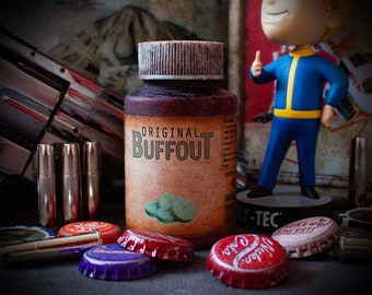 May include: A brown bottle with a white label that reads "Original Buffout". The bottle is surrounded by bottle caps and a small figurine of a person wearing a blue jumpsuit.