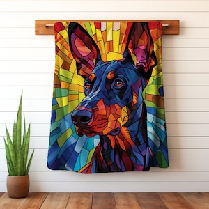 May include: A colorful stained glass style illustration of a Doberman Pinscher dog. The dog's fur is black and brown with a red nose and blue eyes. The background is a vibrant mix of yellow, orange, blue, and green.