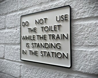Retro Train Sign "Do Not Use The Toilet While The Train Is Standing In The Station"