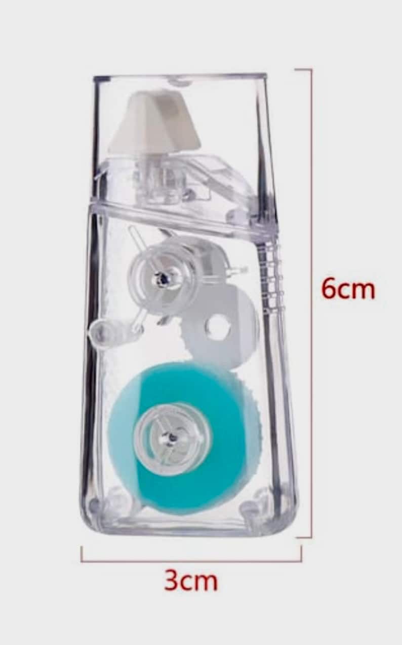 May include: A clear plastic tape dispenser with a blue tape roll. The dispenser is 6 inches tall and 3 inches wide.
