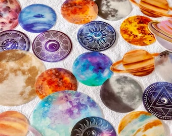 May include: A set of 18 round stickers featuring watercolor planets, moons, and celestial designs. The stickers are perfect for adding a touch of whimsy to journals, planners, and other craft projects.