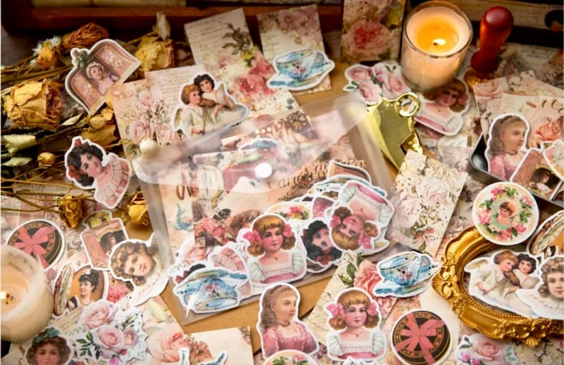 May include: A sheet of vintage-style stickers featuring images of children, flowers, and teacups. The stickers are printed on white paper and have a distressed, antique look.