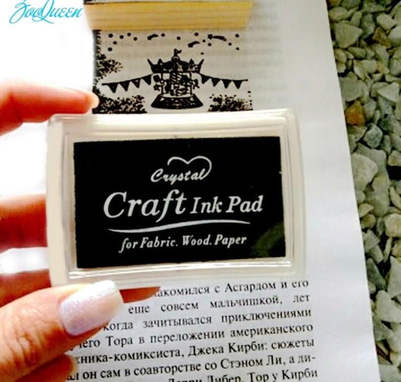 May include: A black ink pad with a clear plastic case. The ink pad is labeled "Crystal Craft Ink Pad for Fabric. Wood. Paper".