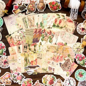 May include: A collection of vintage-style stickers featuring floral patterns, clocks, birds, and teapots. The stickers are printed on a cream-colored background with a distressed look.