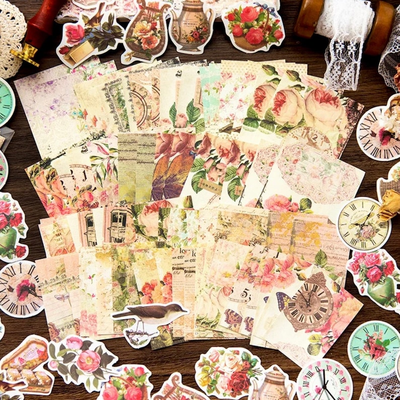 May include: A collection of vintage-style stickers featuring floral patterns, clocks, birds, and teapots. The stickers are printed on a cream-colored background with a distressed look.