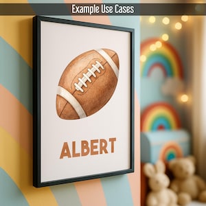 May include: A framed print with a watercolour illustration of a brown American football, white laces and stripes. The name "ALBERT" is printed in brown below the football. The frame is black, and the background is a light colour.