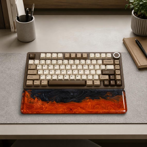 Poured resin wrist rest that looks like actual molten lava mid-flow — genuinely eye-catching and functionally clever for keyboard nerds.