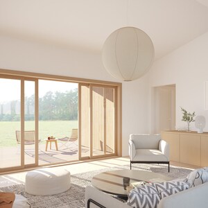 May include: A bright, airy living room with a large sliding glass door leading to a deck. The room features a white sofa, armchair, and a round paper lantern. A wooden cabinet and abstract art complete the modern interior.