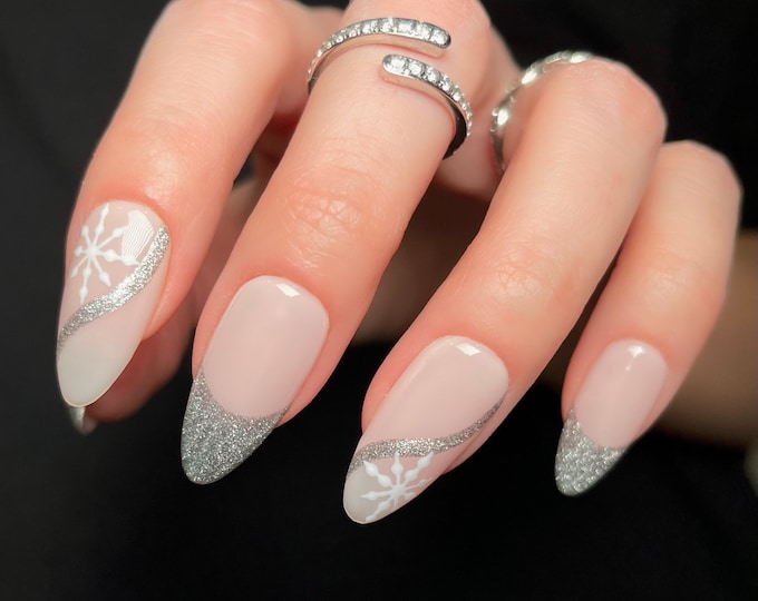 Silver glitter nails with snowflake accent