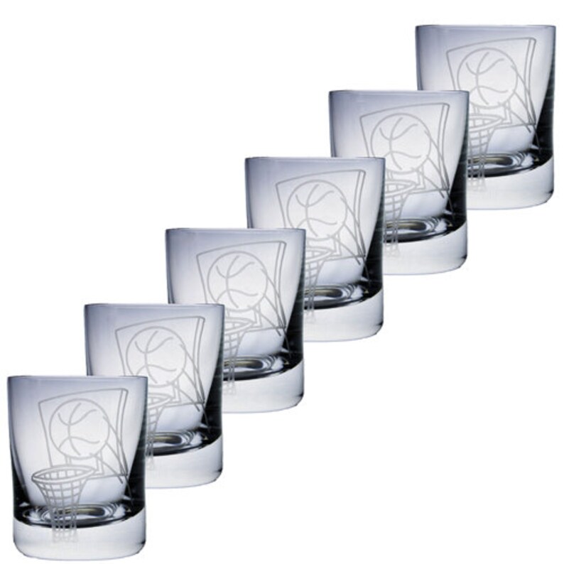 May include: Six clear glass tumblers with a basketball and hoop design etched on the front. The glasses are arranged in a diagonal row, showcasing the etched basketball graphic. The glasses are likely for drinking beverages.