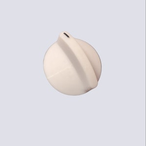 May include: White plastic knob with a black line down the center.