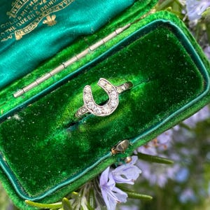 Antique diamond and paste 9ct gold horseshoe ring