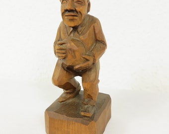 Old wooden figure of little old man