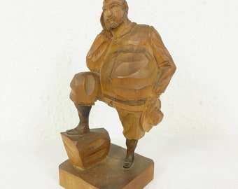 Old wooden figure of thick bearded man