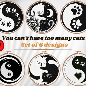 May include: Set of six black and white embroidery patterns featuring cats and paw prints in a yin yang design. The text "You can't have too many cats :) Set of 6 designs" is displayed below the images.