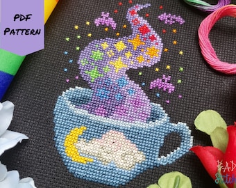 May include: Cross stitch pattern of a blue teacup with a purple, pink, and yellow magical steam rising from it. The steam is filled with stars, bats, and other magical elements. The teacup has a white cloud and a yellow crescent moon inside.