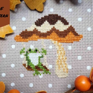 Swinging Frog Cross Stitch Pattern, Autumn Mushroom, Cottagecore Gallery Art, Fall Vibes, seasonal sampler needlework, instant download PDF