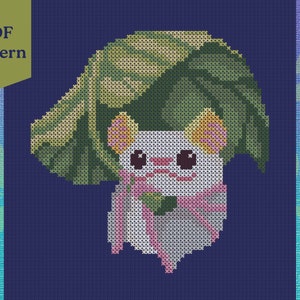May include: Cross stitch pattern featuring a white animal with pink ears and a green leaf on its head. The animal is wearing a pink ribbon and is under a large green leaf. The pattern is on a blue background.