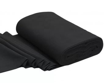 Puede incluir: Un rollo de tela negra, doblado y listo para usar en proyectos de manualidades o costura.