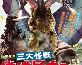 May include: A movie poster for the Japanese film "Destroy All Monsters" featuring Godzilla, Rodan, and King Ghidorah. The poster is in Japanese and features the text "Earth's Greatest Battle".