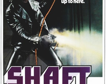 May include: A movie poster for the film "Shaft" starring Richard Roundtree. The poster features a black and white image of a man in a leather jacket holding a gun. The text on the poster reads "The mob wanted Harlem back. They got Shaft... up to here. SHAFT's his name. SHAFT's his game."