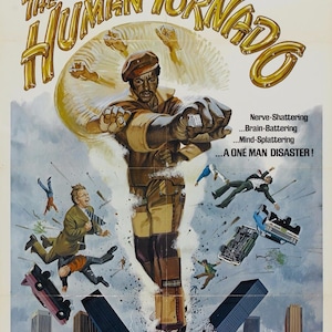 May include: Movie poster for the film "The Human Tornado" starring Rudy Ray Moore. The poster features a yellow and gold illustration of a man in a brown jumpsuit and cap, with his arms outstretched, as if he is spinning. The poster also features the text "Watch out mister... Here comes the twister!" and "Nerve-Shattering... Brain-Battering... Mind-Splattering... A One Man Disaster!"