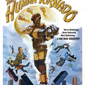 May include: Movie poster for the film "The Human Tornado" starring Rudy Ray Moore. The poster features a colorful illustration of a man in a brown and yellow jumpsuit, with a tornado swirling around him. The text on the poster reads "Watch out mister... here comes the twister! Rudy Ray Moore is The Human Tornado."