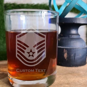 May include: A set of three ceramic mugs with a speckled, matte finish. The mugs are in shades of cream, light brown, and dark brown. Each mug has a rounded handle and a simple, minimalist design.