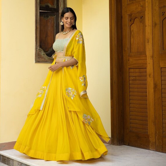 Yellow lehenga choli shop designs for engagement