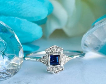 18KT White Gold Sapphire and Diamond Ring
