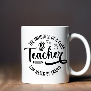 May include: White ceramic mug with a black design that reads "The influence of a good teacher can never be erased". The design also includes a globe, apple, pencil, and hearts.