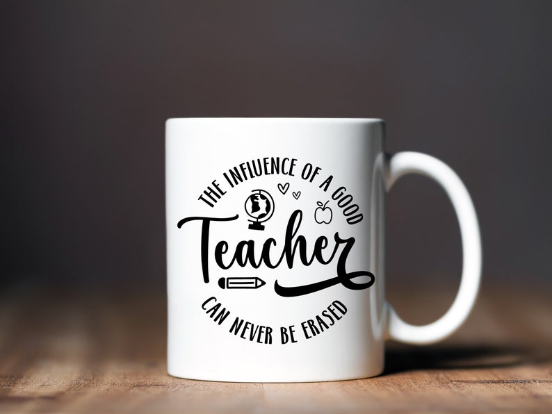 May include: White ceramic mug with a black design that reads "The influence of a good teacher can never be erased". The design also includes a globe, apple, pencil, and hearts.