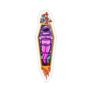 May include: A sticker featuring an astronaut in a pink spacesuit inside a golden coffin with a starry background. The coffin is surrounded by colorful mushrooms and flames.