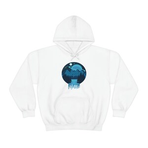 May include: White hooded sweatshirt with a blue and white graphic print of a mountain landscape with a planet and moon in the sky. The graphic is dripping down the bottom.