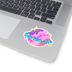 May include: A pink and purple planet with a blue ring and gold stars. The planet has a dripping, gooey texture.